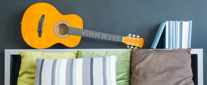 Guitar lying on shelf