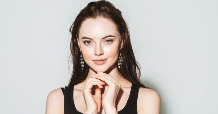 Woman wearing jewelry that matches her skin tone